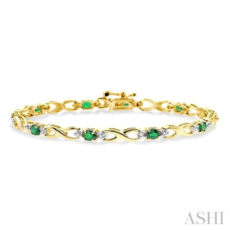 4x3 MM Oval Cut Emerald and 1/10 Ctw Single Cut Diamond Bracelet in 14K Yellow Gold